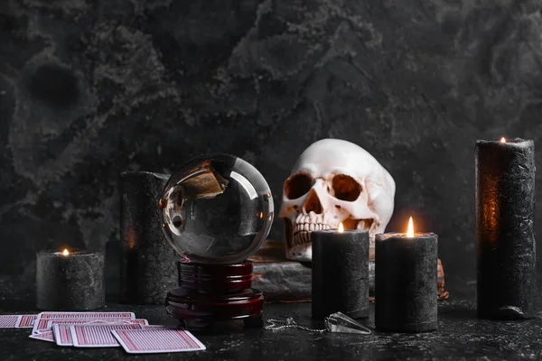 Accessories of fortune teller on dark background