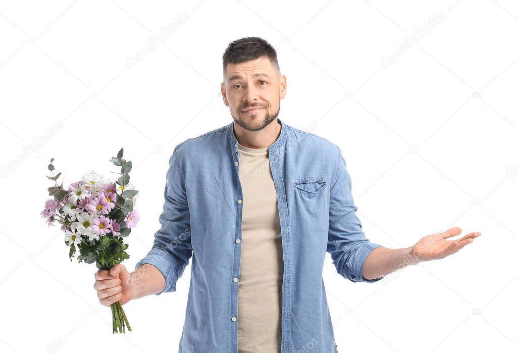 Confused man with bouquet of beautiful flowers on white background
