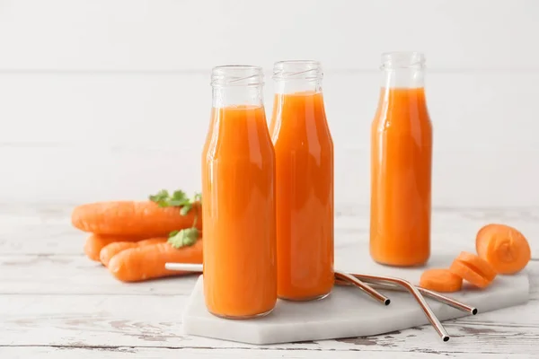 Bottles Tasty Carrot Juice Light Background — Stock Photo, Image