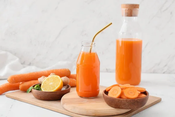 Bottles Tasty Carrot Juice Light Background — Stock Photo, Image