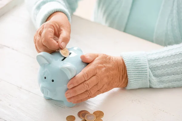 Senior Woman Putting Coin Piggy Bank Table Concept Pension — Stock Photo, Image