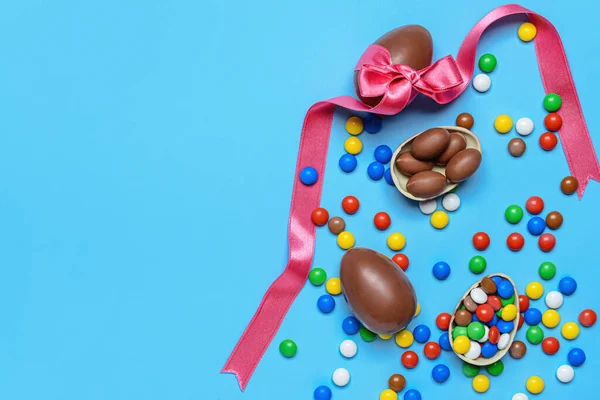 Tasty Chocolate Eggs Candies Color Background — Stock Photo, Image