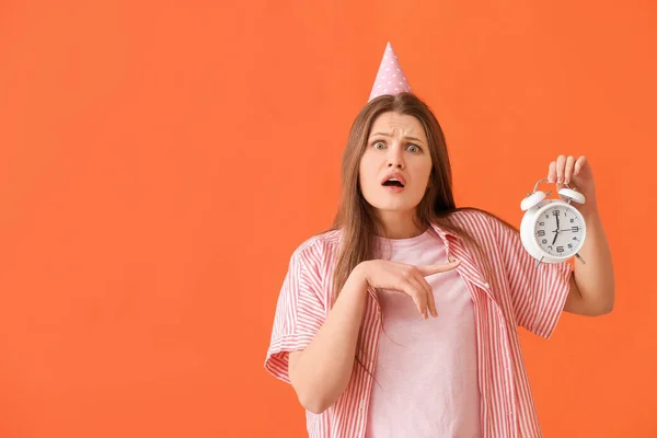 Stressed Woman Alarm Clock Celebrating Birthday Color Background — Stock Photo, Image