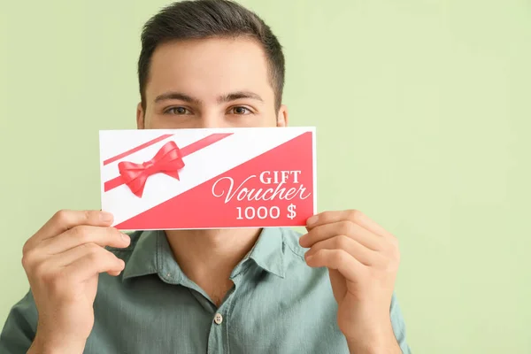 Handsome Young Man Gift Voucher Color Background — Stock Photo, Image