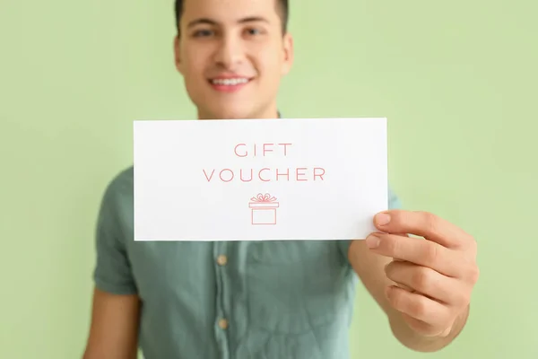 Handsome Young Man Gift Voucher Color Background — Stock Photo, Image