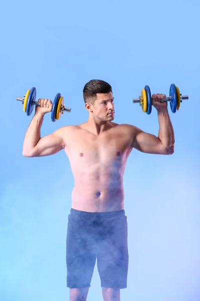 Sporty Young Man Training Dumbbells Color Background — Stock Photo, Image