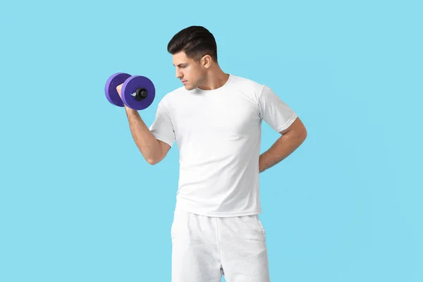 Sporty Young Man Training Dumbbell Color Background — Stock Photo, Image