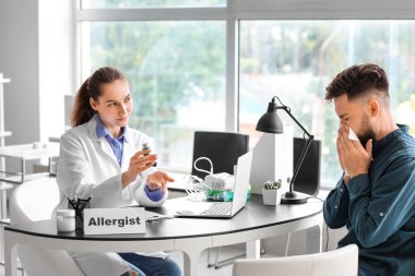Man visiting allergist in clinic clipart