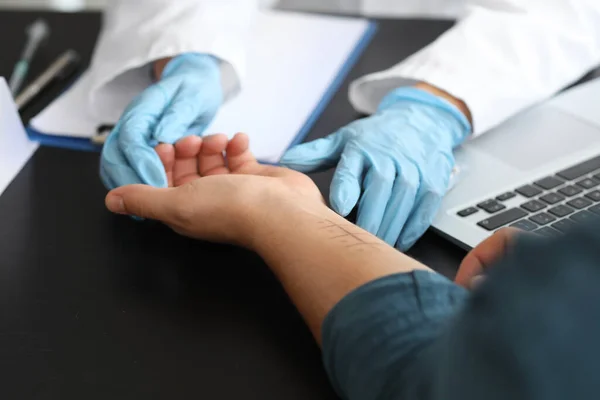 Man undergoing allergen skin test in clinic, closeup