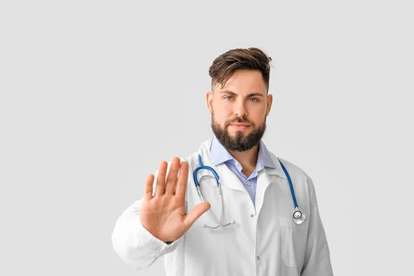 Doctor Showing Stop Gesture Light Background — Stock Photo, Image