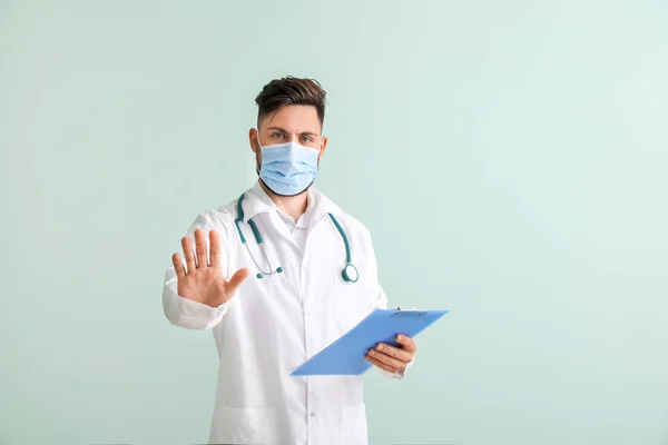 Male Doctor Showing Stop Gesture Color Background — Stock Photo, Image