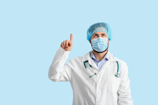 Doctor Medical Mask Pointing Something Color Background — Stock Photo, Image