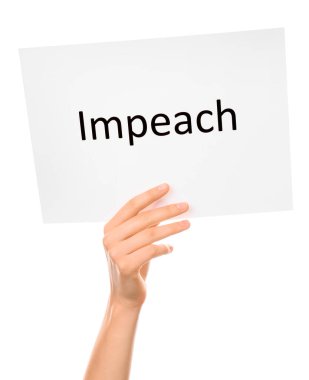 Beyaz zemin üzerinde IMPEACH metin ile el ele kağıt