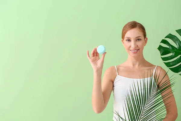 Beautiful Young Woman Facial Cream Tropical Leaves Color Background — Stock Photo, Image