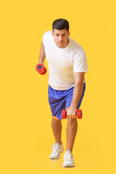 Sporty Young Man Training Dumbbells Color Background — Stock Photo, Image