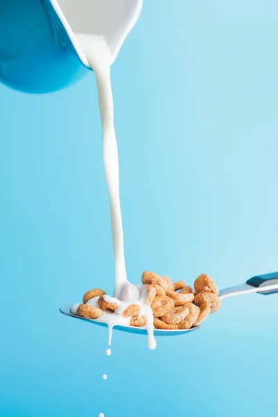 Pouring Milk Jug Spoon Cereal Rings Color Background — Stock Photo, Image