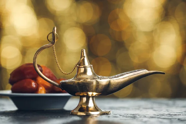 Aladdin Lamp Wishes Dates Table Blurred Lights — Stock Fotó