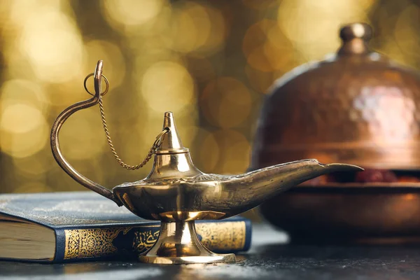 Aladdin Lamp Wishes Koran Table Blurred Lights — Stock Fotó