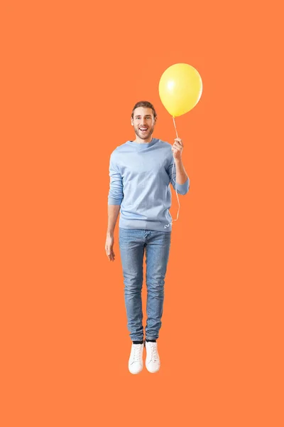 Handsome Jumping Young Man Balloon Color Background — Stock Photo, Image