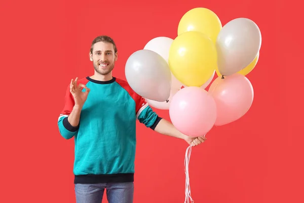 Handsome Young Man Balloons Showing Color Background — Stock Photo, Image