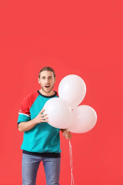 Surprised Young Man Balloons Color Background — Stock Photo, Image
