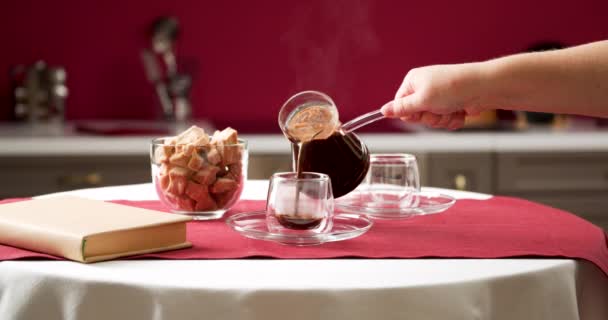 Woman Pouring Hot Coffee Jezve Glasses Table — Stock Video