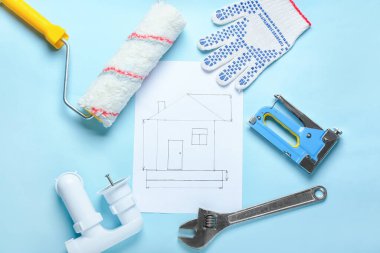 Renk arkaplanı üzerinde inşaat araçları olan ev planı