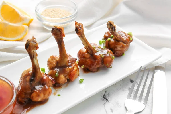 Plate Tasty Chicken Lollipops Light Background — Stock Photo, Image