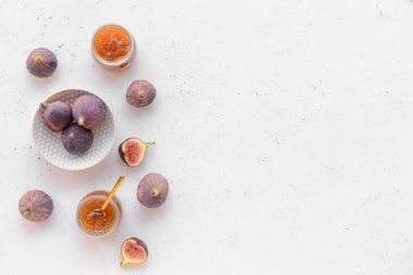 Composition with sweet fig jam on light background