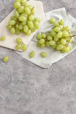 Ripe green grapes on grunge background