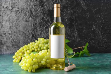 Bottle of tasty white wine on table