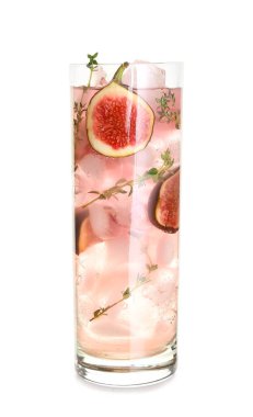 Glass of tasty fig lemonade on white background