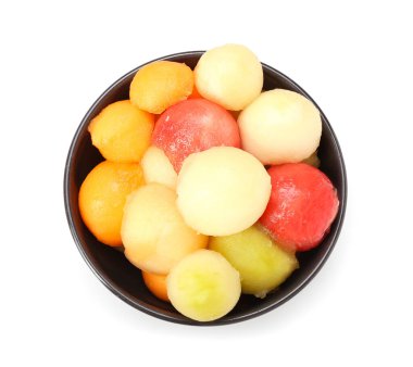 Bowl with sweet fruit balls on white background