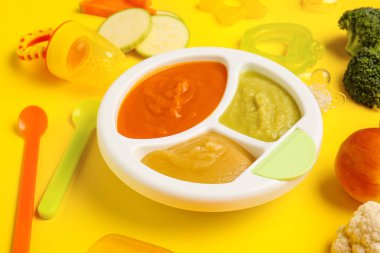 Composition with healthy baby food on color background, closeup