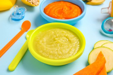 Composition with healthy baby food on color background, closeup