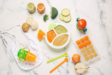 Composition with healthy baby food and ingredients on light background