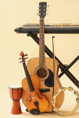 Different musical instruments on color background