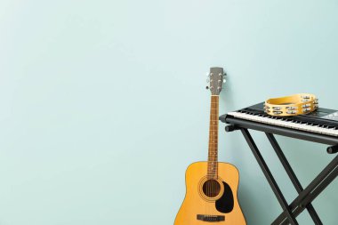 Different musical instruments on color background