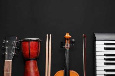 Different musical instruments on dark background