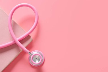 Renk arkaplanı üzerine stetoskop ve defter