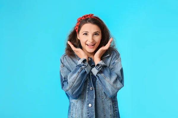 Happy young woman on color background