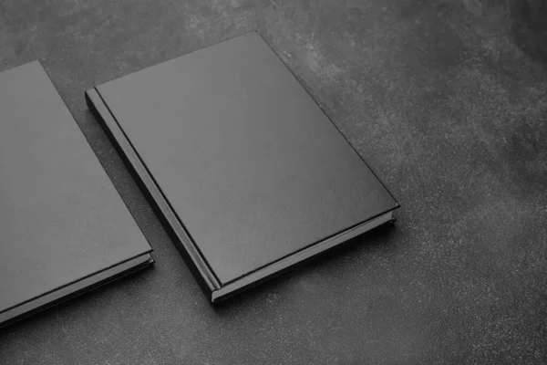 Blank books on dark background