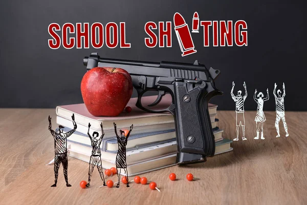 Gun with apple, stack of books and drawn tiny people on table. Problem of shooting at school