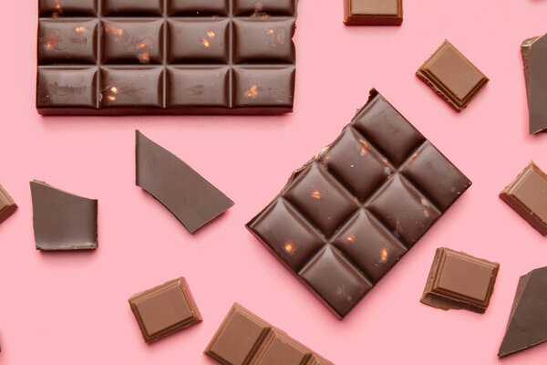 Composition with different chocolate on color background