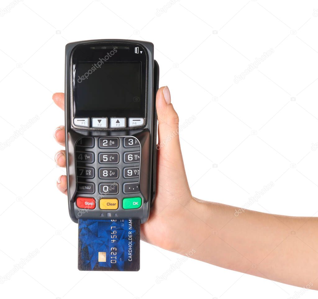 Female hand with credit card and payment terminal on white background