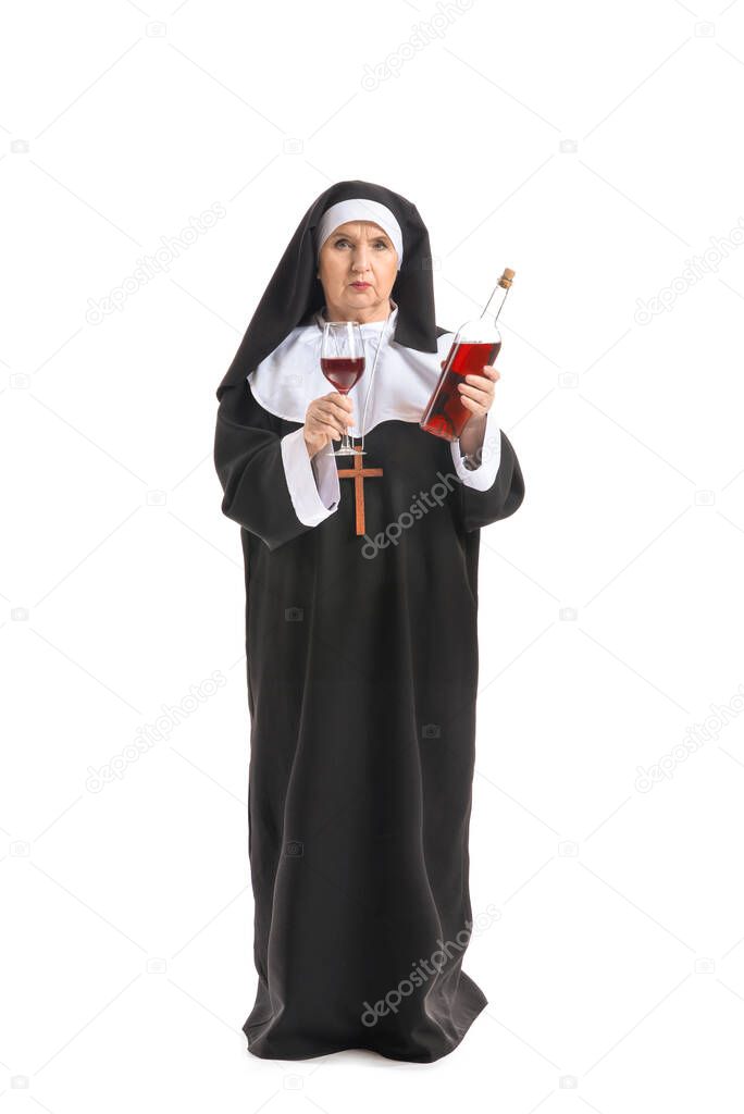 Senior nun with alcohol on white background