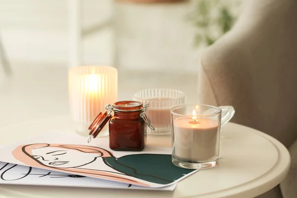 Aroma candles on table in room