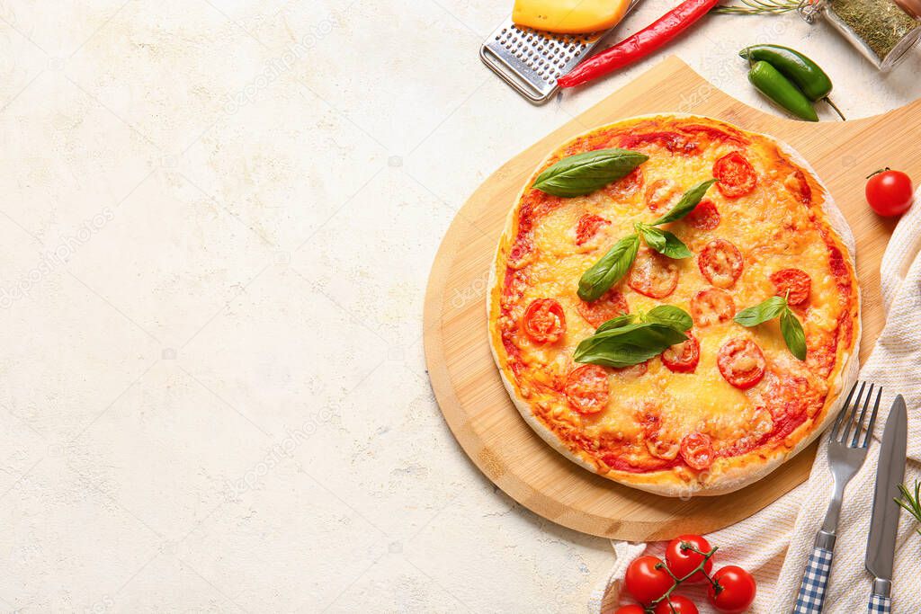 Board with tasty pizza on light background
