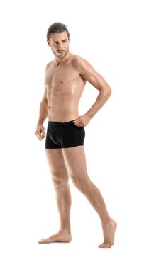 Beyaz arka plandaki seksi genç adam.