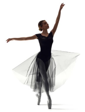 Beyaz arka planda genç ve güzel bir balerin silueti